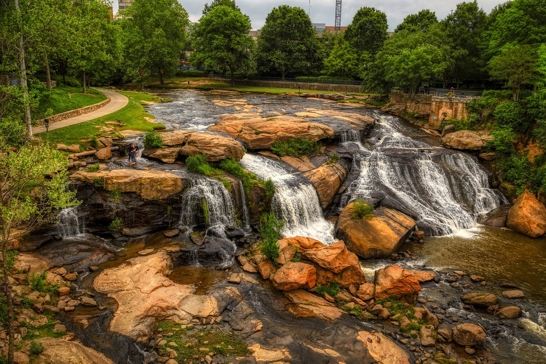 SMALL WATERFALL OVER RED ROCKS